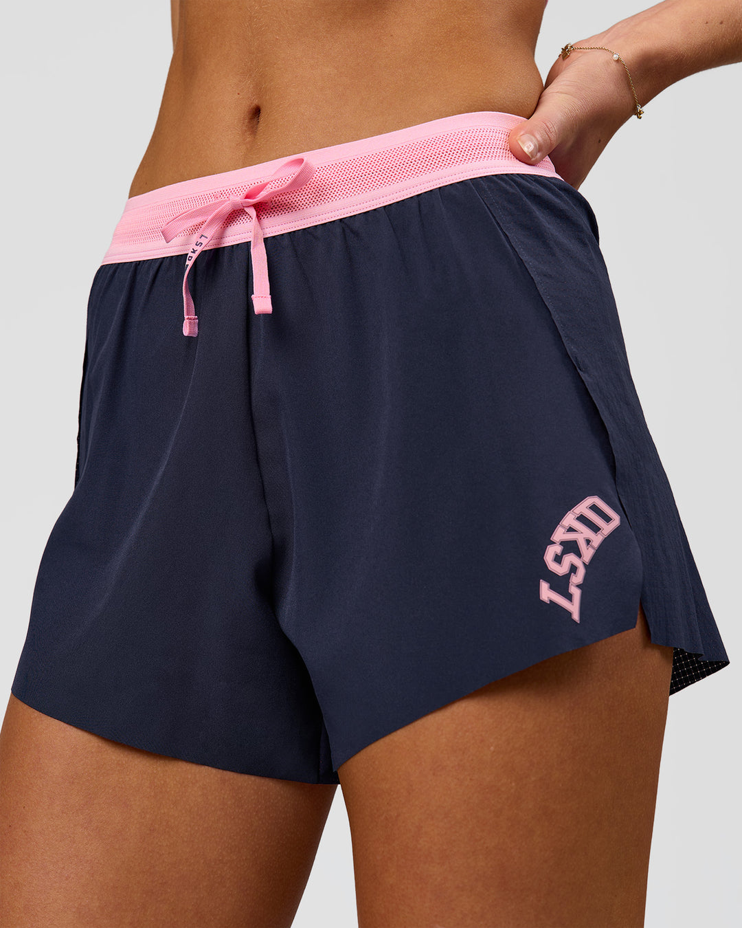 Woman wearing Accelerate 3" High-Rise Running Short - Future Navy-Varsity print | Model:Issy | Size:XS - view 1