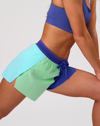 Woman wearing Accelerate 3" High-Rise Running Short - Power Cobalt-Prism | Model:Issy | Size:XS | Thumbnail Index: 6