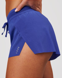 Woman wearing Accelerate 3" Mid-Rise Running Short - Power Cobalt | Model:Issy | Size:XS | Thumbnail Index: 4