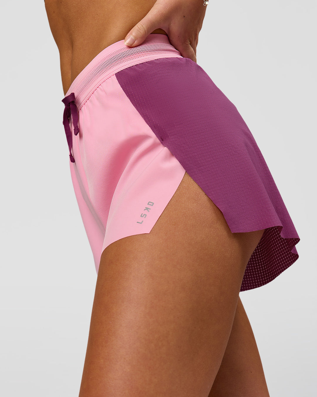 Woman wearing Accelerate 3" High-Rise Running Short - Boysenberry-Pink Rose | Model:Issy | Size:XS - view 2