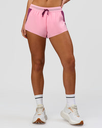Woman wearing Accelerate 3" Mid-Rise Running Short - Boysenberry-Pink Rose | Model:Issy | Size:XS | Thumbnail Index: 3