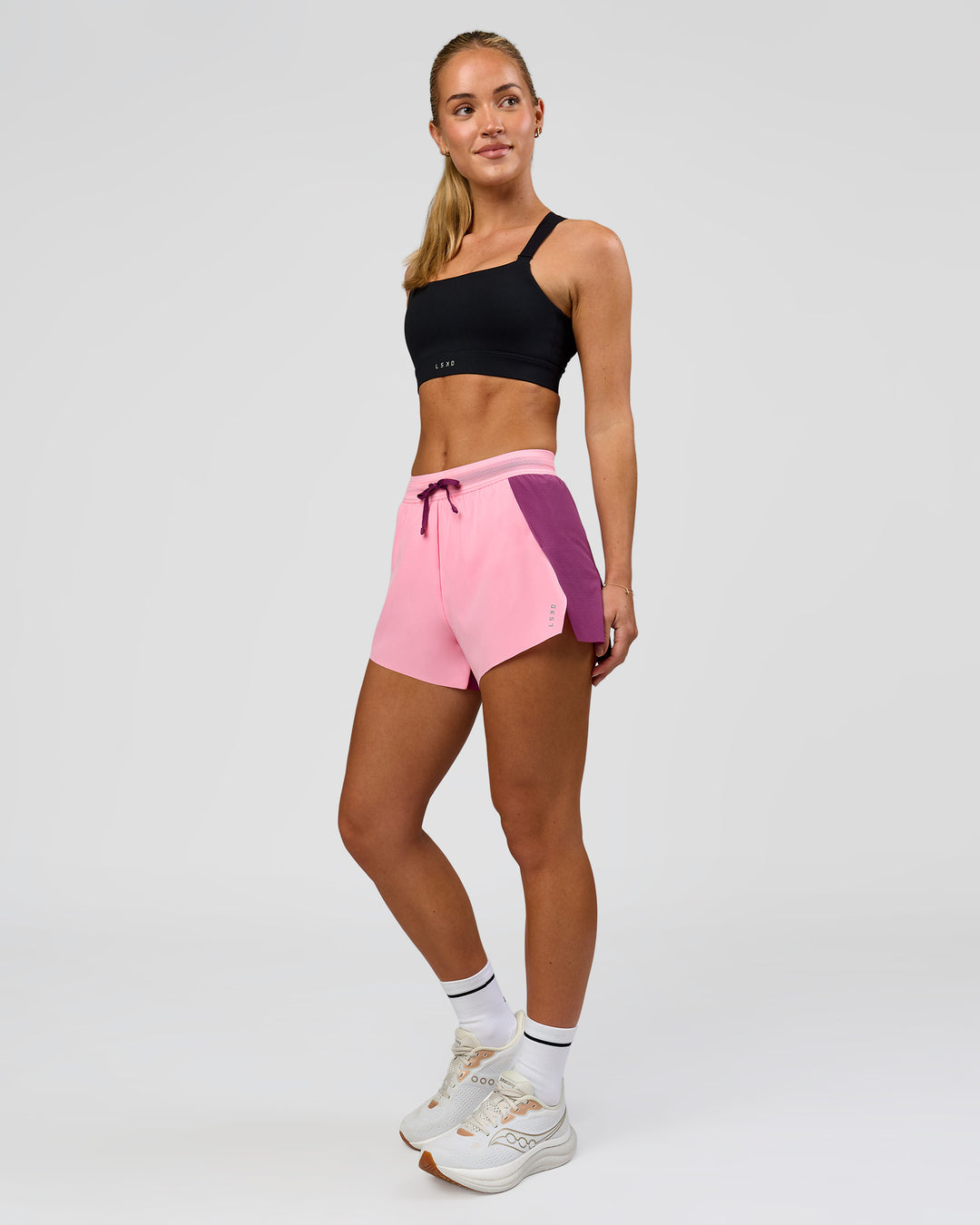 Woman wearing Accelerate 3" High-Rise Running Short - Boysenberry-Pink Rose | Model:Issy | Size:XS - view 7