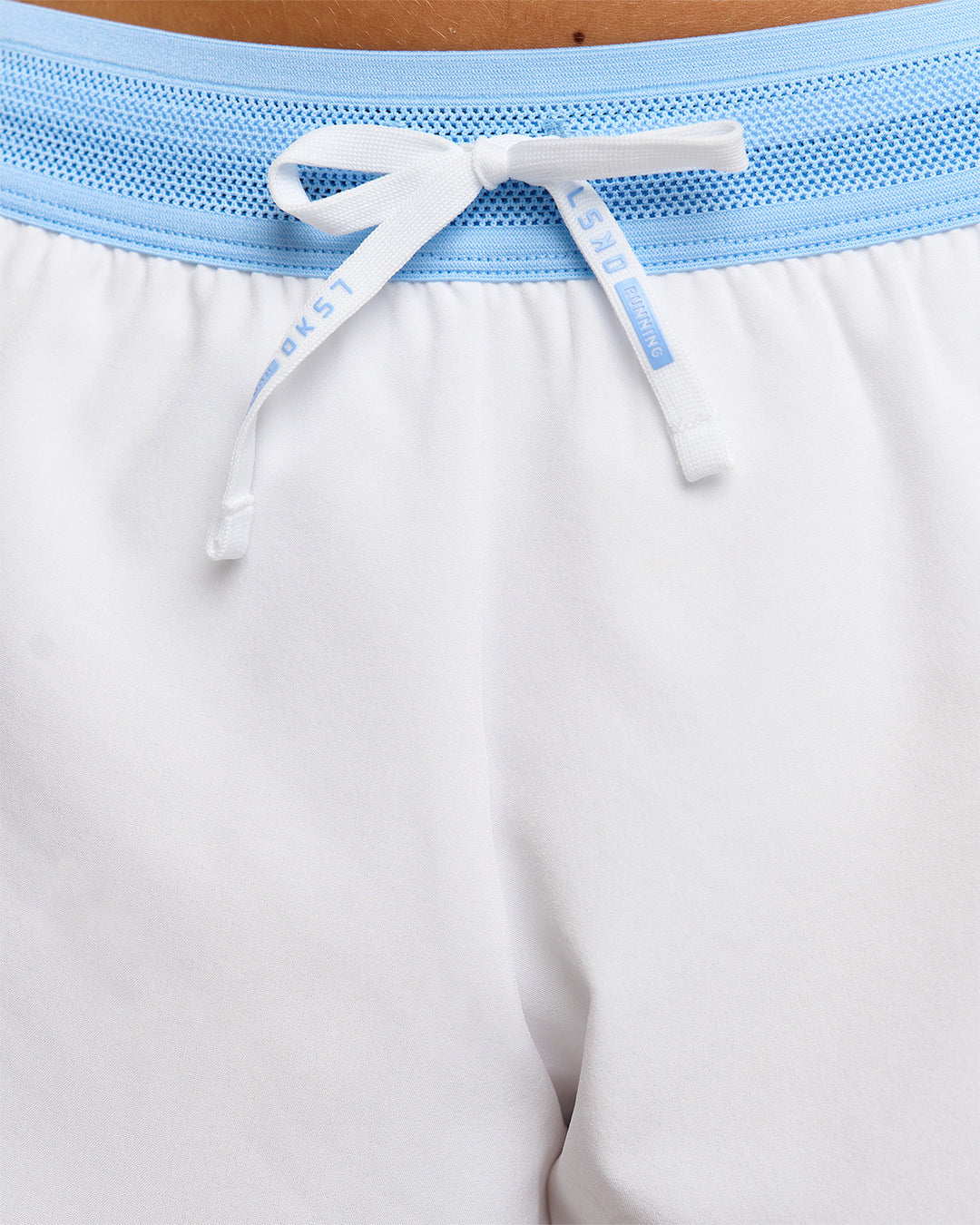 Woman wearing Accelerate 3" Mid-Rise Running Short - Open Air-White | Model:Issy | Size:XS - view 16