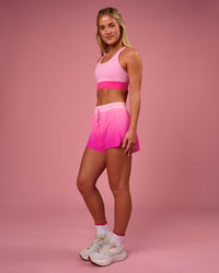 Woman wearing Accelerate Gradient 3" High-Rise Running Short - Pink Rose-Ultra Pink Gradient | Model:Issy | Size:XS | Thumbnail Index: 4