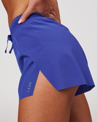 Woman wearing Accelerate 3" High-Rise Running Short - Power Cobalt | Model:Issy | Size:XS | Thumbnail Index: 1