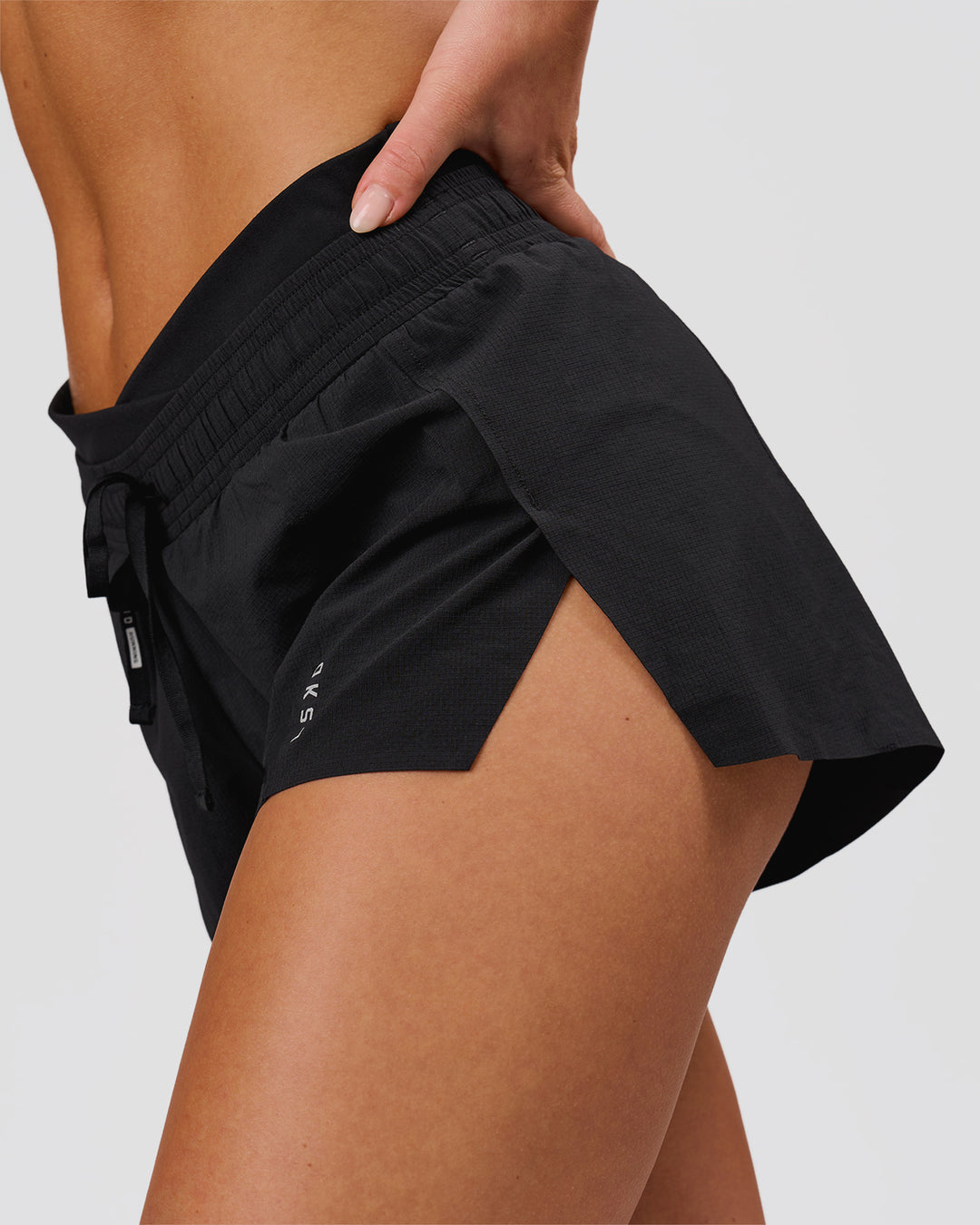 Woman wearing Accelerate Synergy 3" Running Short Short - Black-Black | Model:Issy | Size:XS - view 4