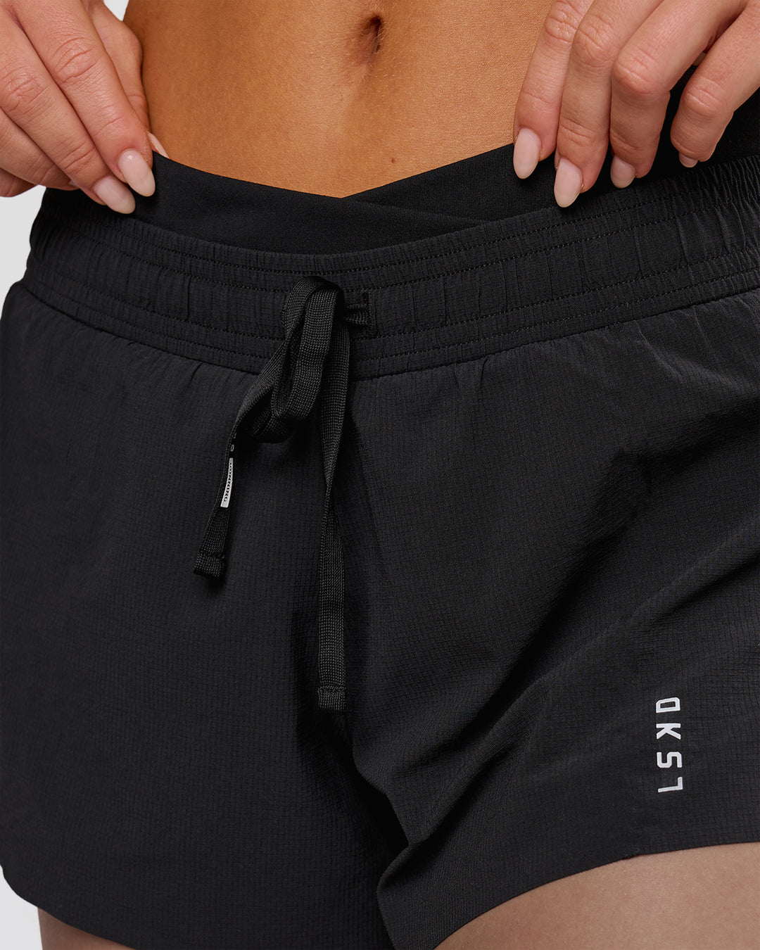 Woman wearing Accelerate Synergy 3" Running Short Short - Black-Black | Model:Issy | Size:XS - view 5