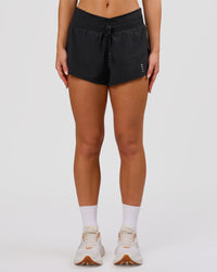 Woman wearing Accelerate Synergy 3" Running Short Short - Black-Black | Model:Issy | Size:XS | Thumbnail Index: 7