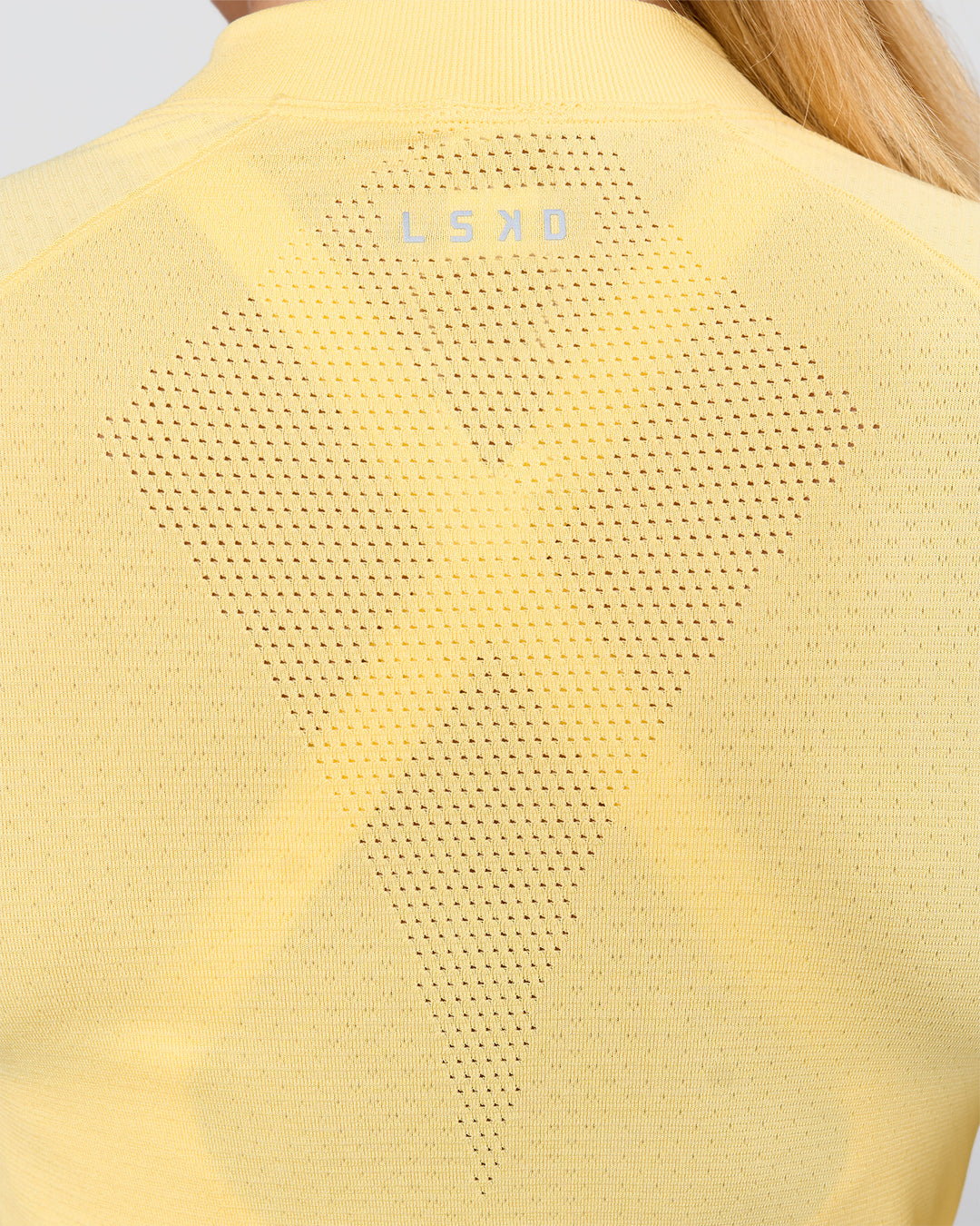 Woman wearing AeroFLX+ Long Sleeve Half Zip - Lemon/Lemon | Model:Issy | Size:XS - view 4