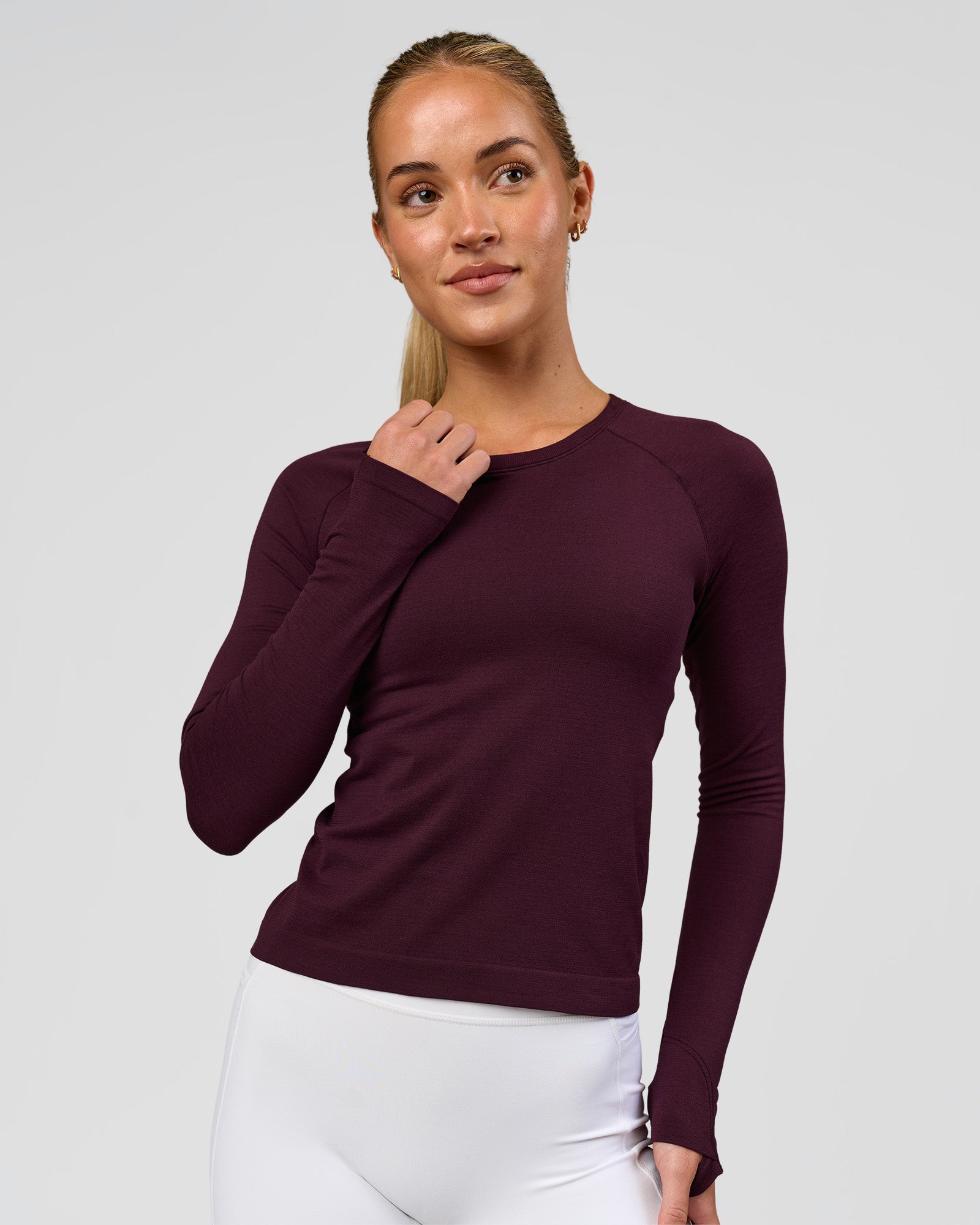 Woman wearing AeroFLX+ Seamless Long Sleeve Tee - Cherry Lacquer/Cherry Lacquer | Model:Issy | Size:XS