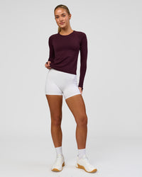 Woman wearing AeroFLX+ Seamless Long Sleeve Tee - Cherry Lacquer/Cherry Lacquer | Model:Issy | Size:XS | Thumbnail Index: 2
