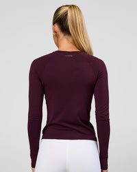 Woman wearing AeroFLX+ Seamless Long Sleeve Tee - Cherry Lacquer/Cherry Lacquer | Model:Issy | Size:XS | Thumbnail Index: 7