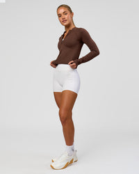 Woman wearing AeroFLX+ Long Sleeve Skimmer Half Zip - Hot Chocolate/Hot Chocolate | Model:Issy | Size:XS | Thumbnail Index: 4
