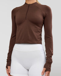 Woman wearing AeroFLX+ Long Sleeve Skimmer Half Zip - Hot Chocolate/Hot Chocolate | Model:Issy | Size:XS | Thumbnail Index: 6