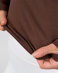 Woman wearing AeroFLX+ Long Sleeve Skimmer Half Zip - Hot Chocolate/Hot Chocolate | Model:Issy | Size:XS | Thumbnail Index: 8