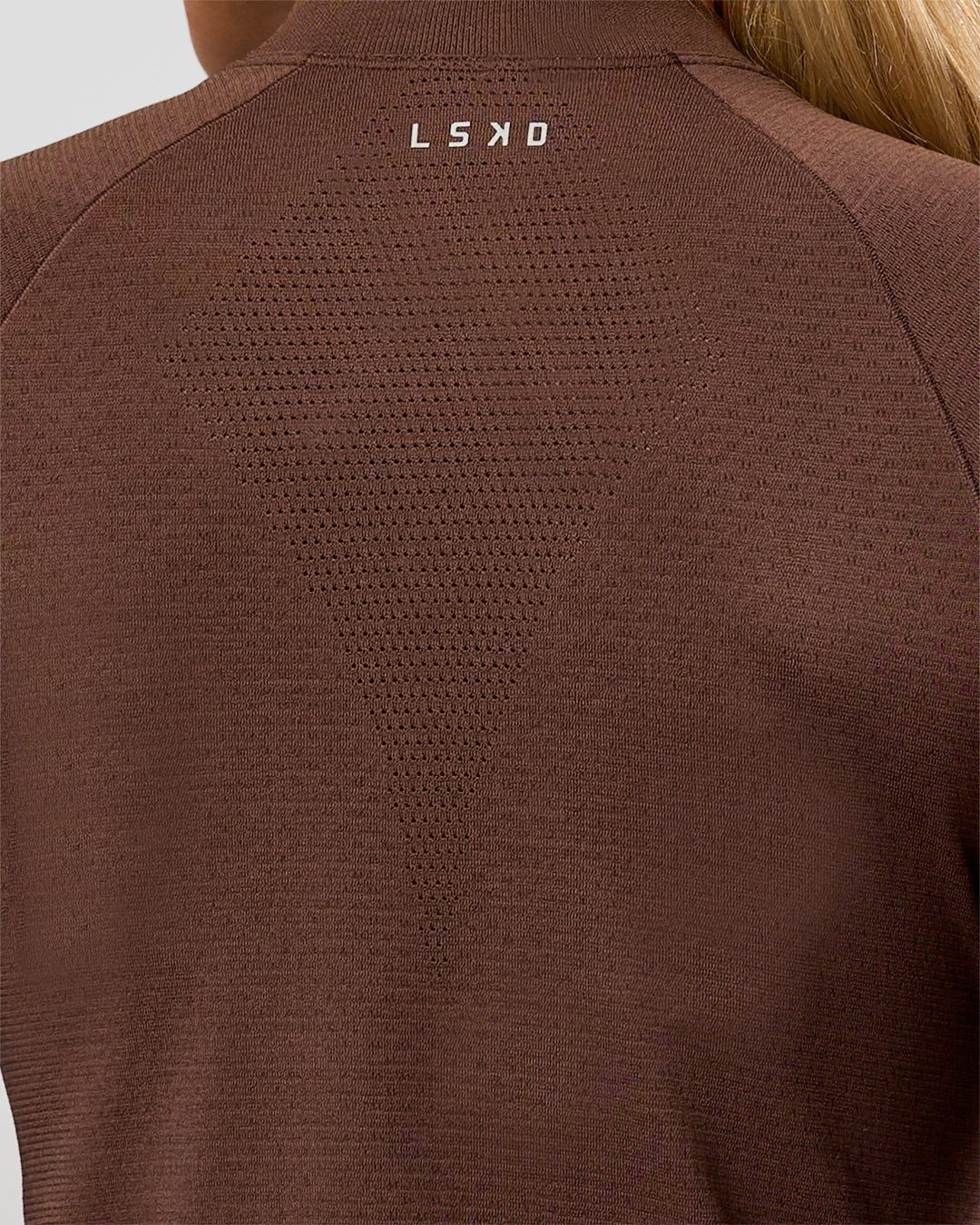 Woman wearing AeroFLX+ Long Sleeve Skimmer Half Zip - Hot Chocolate/Hot Chocolate | Model:Issy | Size:XS - view 13