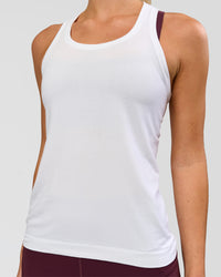 Woman wearing AeroFLX+ Seamless Tank - White/White | Model:Issy | Size:XS | Thumbnail Index: 2