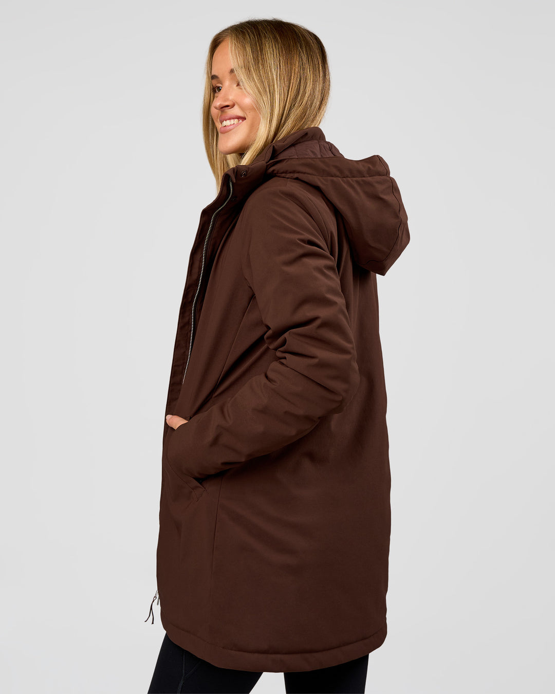 Woman wearing Auxiliary 2.0 Longline Jacket - Hot Chocolate | Model:Issy | Size:XS - view 3