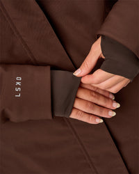 Woman wearing Auxiliary 2.0 Longline Jacket - Hot Chocolate | Model:Issy | Size:XS | Thumbnail Index: 7