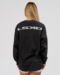 Woman wearing Backline Washed Heavyweight Oversized LS Tee - Black Washed | Model:Issy | Size:XS | Thumbnail Index: 1