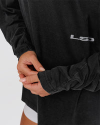 Woman wearing Backline Washed Heavyweight Oversized LS Tee - Black Washed | Model:Issy | Size:XS | Thumbnail Index: 7