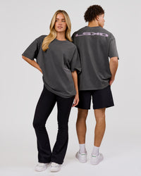 Woman wearing Backline Washed Heavyweight Oversized Tee - Asphalt Washed | Model:Issy | Size:XS | Thumbnail Index: 17