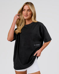 Woman wearing Backline Washed Heavyweight Oversized Tee - Black Washed | Model:Issy | Size:XS | Thumbnail Index: 3