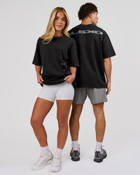 Woman wearing Backline Washed Heavyweight Oversized Tee - Black Washed | Model:Issy | Size:XS | Thumbnail Index: 10
