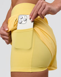 Woman wearing Challenger 3" Lined Performance Short - Lemon | Model:Issy | Size:XS | Thumbnail Index: 1