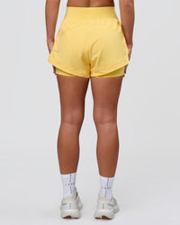 Woman wearing Challenger 3" Lined Performance Short - Lemon | Model:Issy | Size:XS | Thumbnail Index: 3