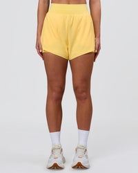 Woman wearing Challenger 3" Lined Performance Short - Lemon | Model:Issy | Size:XS | Thumbnail Index: 5