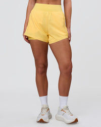 Woman wearing Challenger 3" Lined Performance Short - Lemon | Model:Issy | Size:XS | Thumbnail Index: 7