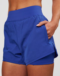 Woman wearing Challenger 3" Lined Performance Short - Power Cobalt | Model:Issy | Size:XS | Thumbnail Index: 0