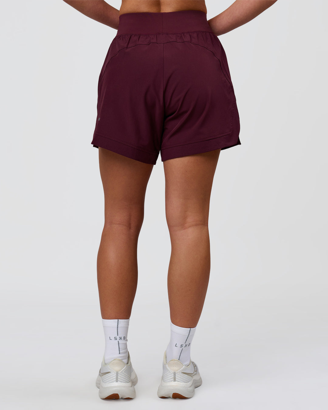Woman wearing Challenger 5" Lined Performance Short - Cherry Lacquer | Model:Issy | Size:XS - view 4