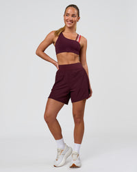 Woman wearing Challenger 5" Lined Performance Short - Cherry Lacquer | Model:Issy | Size:XS | Thumbnail Index: 4