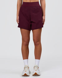 Woman wearing Challenger 5" Lined Performance Short - Cherry Lacquer | Model:Issy | Size:XS | Thumbnail Index: 5