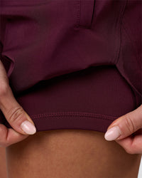 Woman wearing Challenger 5" Lined Performance Short - Cherry Lacquer | Model:Issy | Size:XS | Thumbnail Index: 7