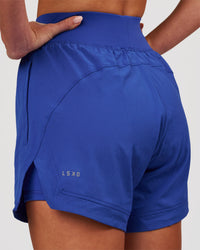 Woman wearing Challenger 5" Lined Performance Short - Power Cobalt | Model:Issy | Size:XS | Thumbnail Index: 0