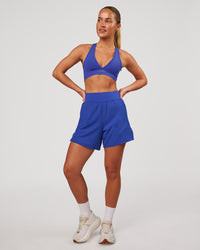 Woman wearing Challenger 5" Lined Performance Short - Power Cobalt | Model:Issy | Size:XS | Thumbnail Index: 2