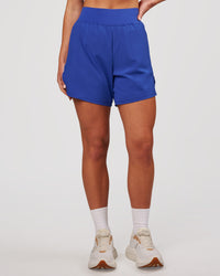Woman wearing Challenger 5" Lined Performance Short - Power Cobalt | Model:Issy | Size:XS | Thumbnail Index: 3