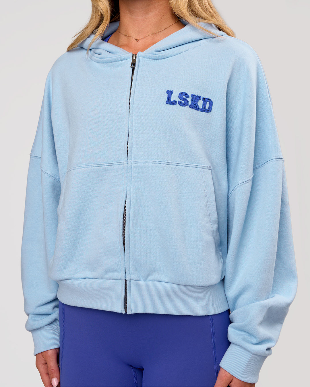 Woman wearing Distress French Terry Full Zip Hoodie - Open Air | Model:Issy | Size:XS - view 1