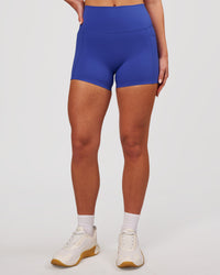 Woman wearing Elixir High-Rise 4" Short Pockets - Power Cobalt | Model:Issy | Size:XS | Thumbnail Index: 4