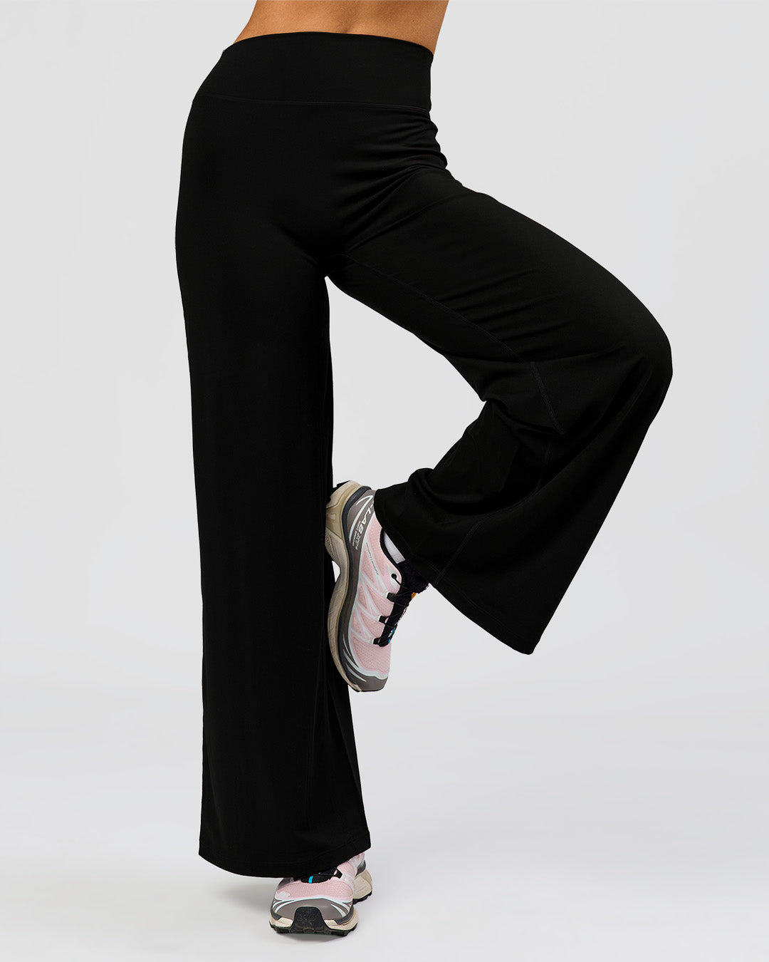 Woman wearing Elixir High-Rise Petite Pant - Black | Model:Issy | Size:XS - view 9