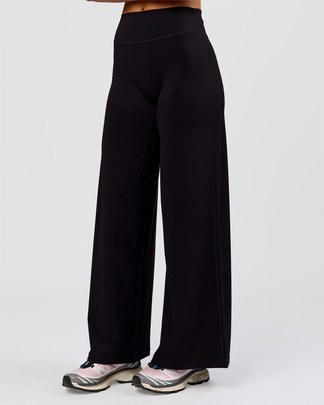 Woman wearing Elixir High-Rise Petite Pant - Black | Model:Issy | Size:XS - view 11