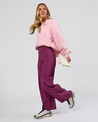 Woman wearing Elixir High-Rise Petite Pant - Boysenberry | Model:Issy | Size:XS | Thumbnail Index: 9