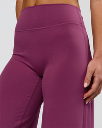 Woman wearing Elixir High-Rise Petite Pant - Boysenberry | Model:Issy | Size:XS | Thumbnail Index: 13