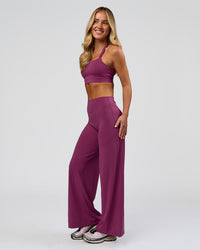 Woman wearing Elixir High-Rise Petite Pant - Boysenberry | Model:Issy | Size:XS | Thumbnail Index: 15