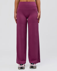 Woman wearing Elixir High-Rise Petite Pant - Boysenberry | Model:Issy | Size:XS | Thumbnail Index: 16
