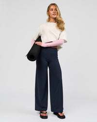 Woman wearing Elixir High-Rise Petite Pant - Midnight Navy | Model:Issy | Size:XS | Thumbnail Index: 4