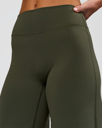Woman wearing Elixir High-Rise Petite Pant - Pure Olive | Model:Issy | Size:XS | Thumbnail Index: 10